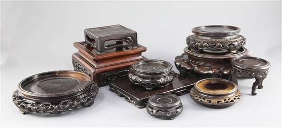 A collection of nine wood Chinese and Japanese hardwood stands, 19th/20th century, the largest 21cm